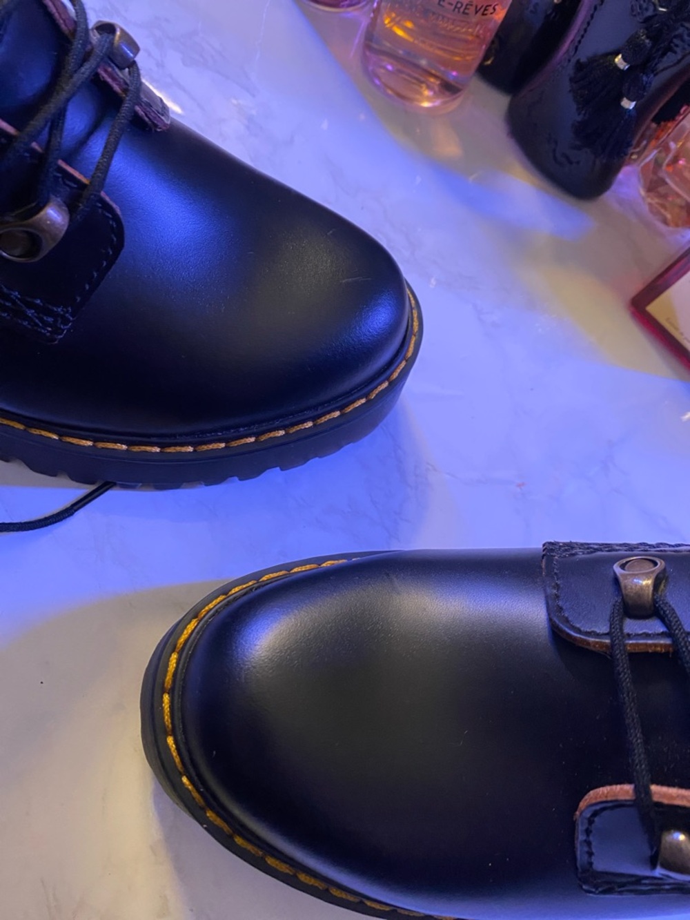 Dr. Martens Black Leather Lug-Heel Combat Boots with Brown Trim